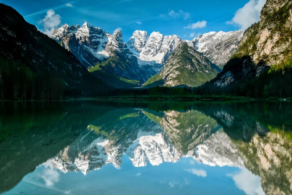Snow-capped Dolomite peaks reflected in the still water of Lake Dürrensee in Italy, shot with the Nikon Z5 and NIKKOR Z 14-30mm f/4 S