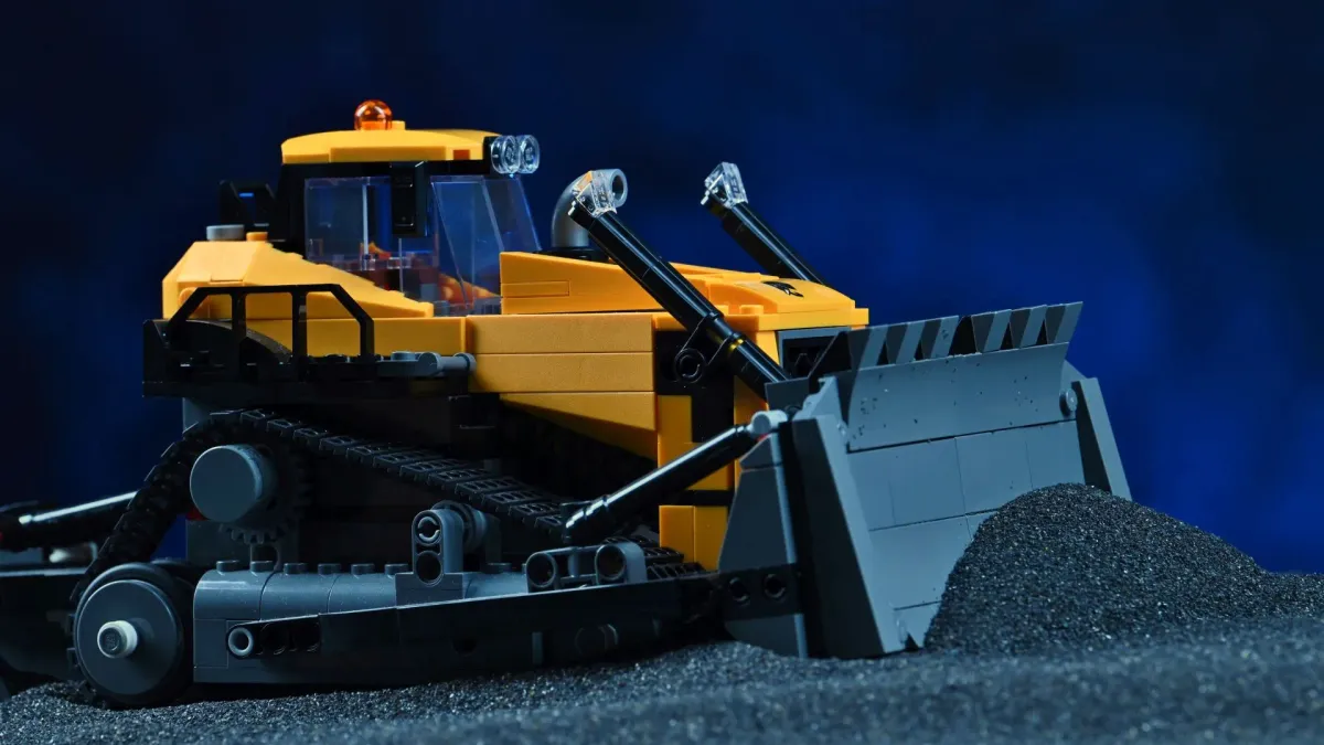 Close-up front view of the LEGO City Yellow Bulldozer (60466), showing the cab, warning beacon and raised pusher blade