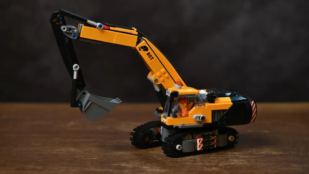 The finished LEGO City Yellow Construction Excavator (60420), showing its tracked chassis, boom arm and rotating cab