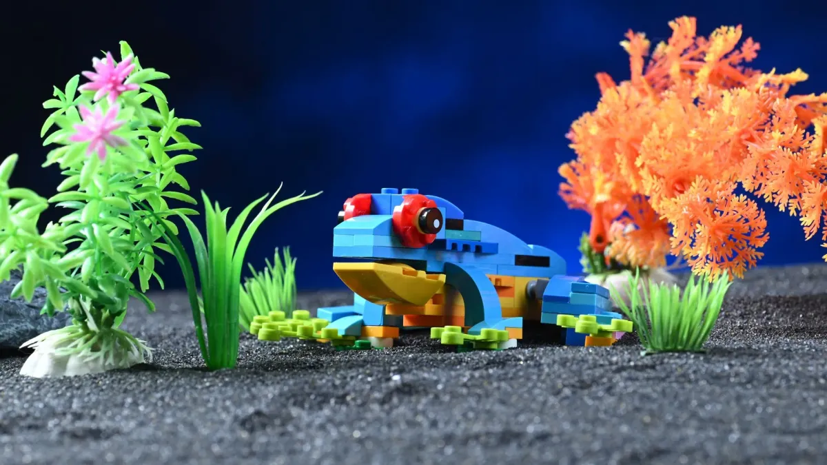 The frog build from LEGO Creator Exotic Parrot (31136), posed with its posable legs splayed for a jump