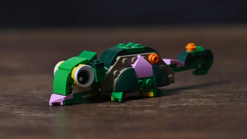 The chameleon alternate build of the LEGO Creator Turtle with a Water Lily Flower (31377) set, with big eyes and curled tail