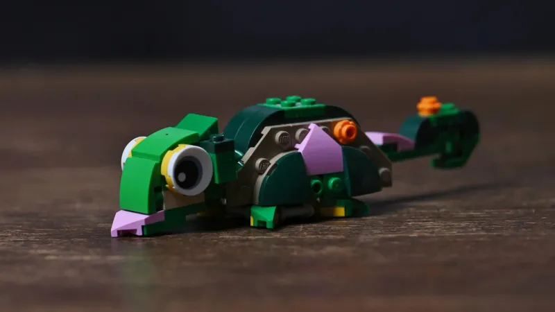 The chameleon alternate build of the LEGO Creator Turtle with a Water Lily Flower (31377) set, with big eyes and curled tail