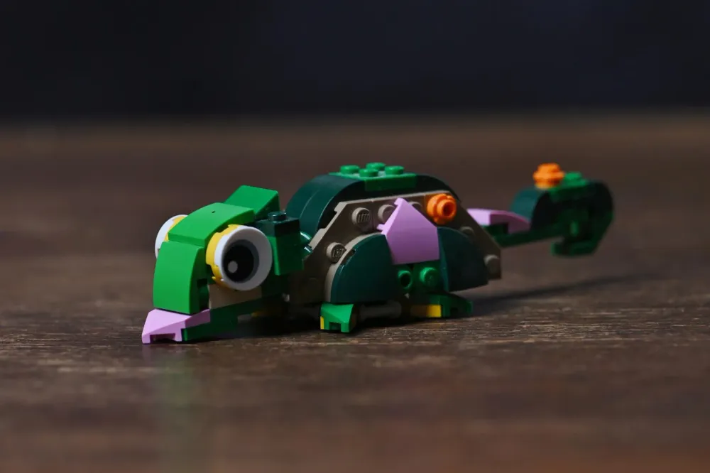 The chameleon alternate build of the LEGO Creator Turtle with a Water Lily Flower (31377) set, with big eyes and curled tail