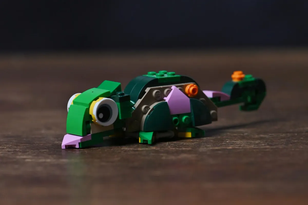 The chameleon build of LEGO Creator Turtle with a Water Lily Flower (31377), showing its googly eyes and curled tail