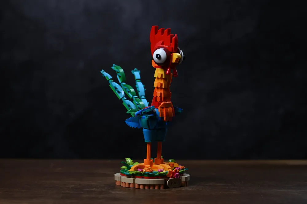 Finished LEGO Disney Moana 2 Heihei (43272) rooster model on its flower-decorated display stand