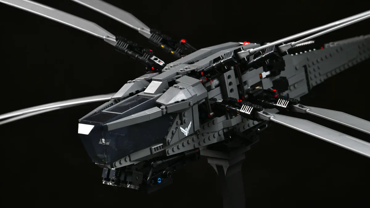 Close-up of the LEGO Dune Ornithopter's cockpit and wing-root greebling, showing the articulated wing joints and dark grey paneling