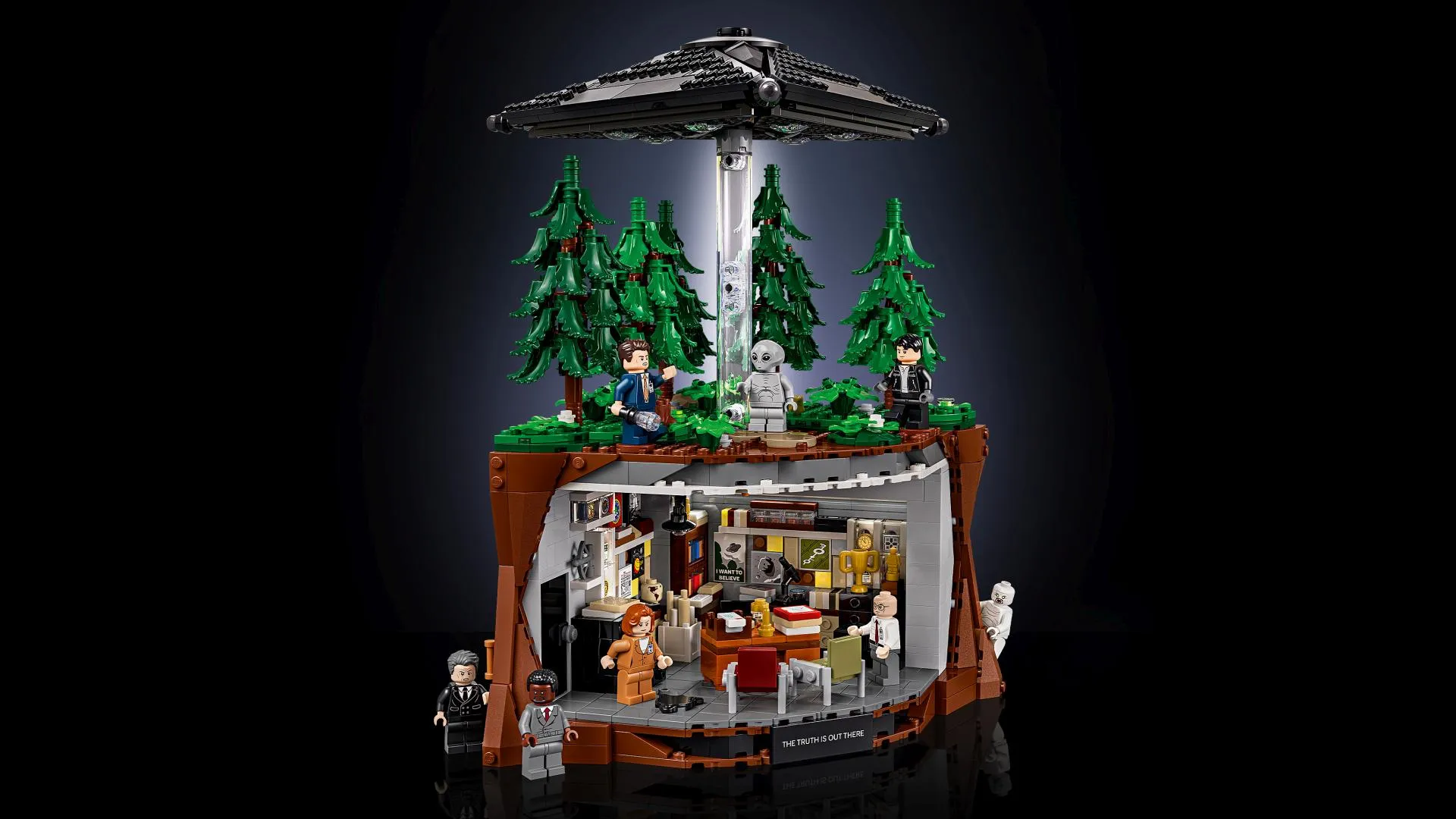 Official LEGO Ideas render of The X-Files (21369) set showing Mulder's office, the UFO scene and the forest base