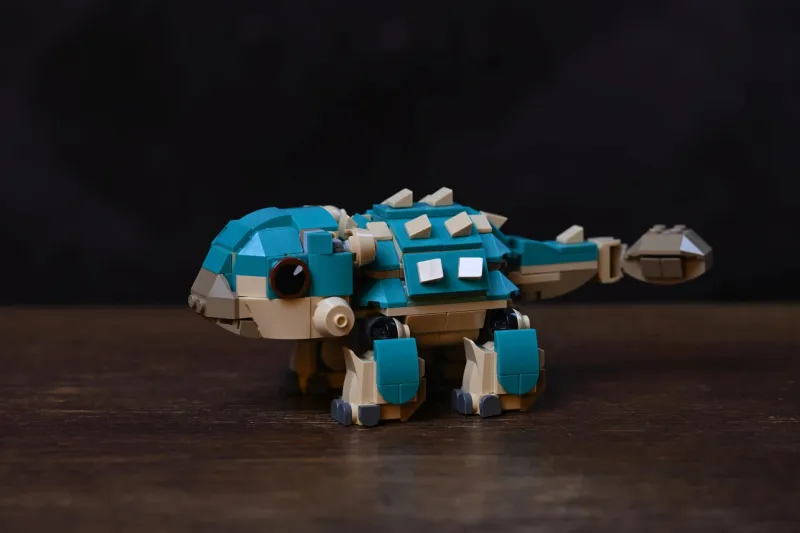 The finished LEGO Jurassic World Baby Bumpy: Ankylosaurus (76962) build, posed on a wooden table