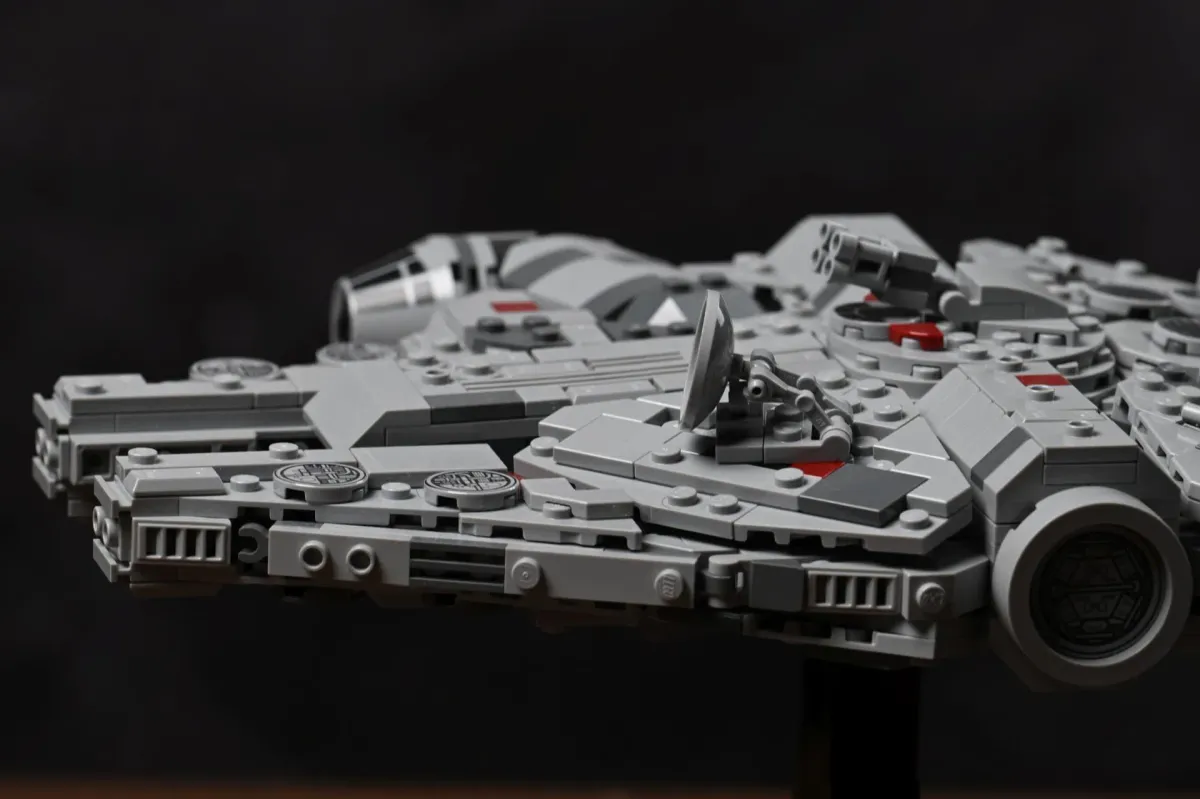 Close-up of the LEGO Millennium Falcon's cockpit, radar dish and quad-laser cannon detailing