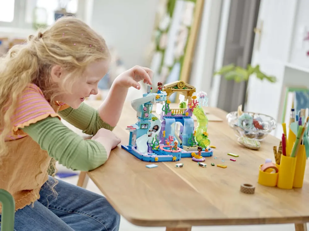 A girl playing with a LEGO Friends water park set - official LEGO lifestyle photo
