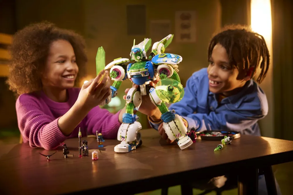 Two kids playing with a big LEGO mech in the evening - official LEGO lifestyle photo