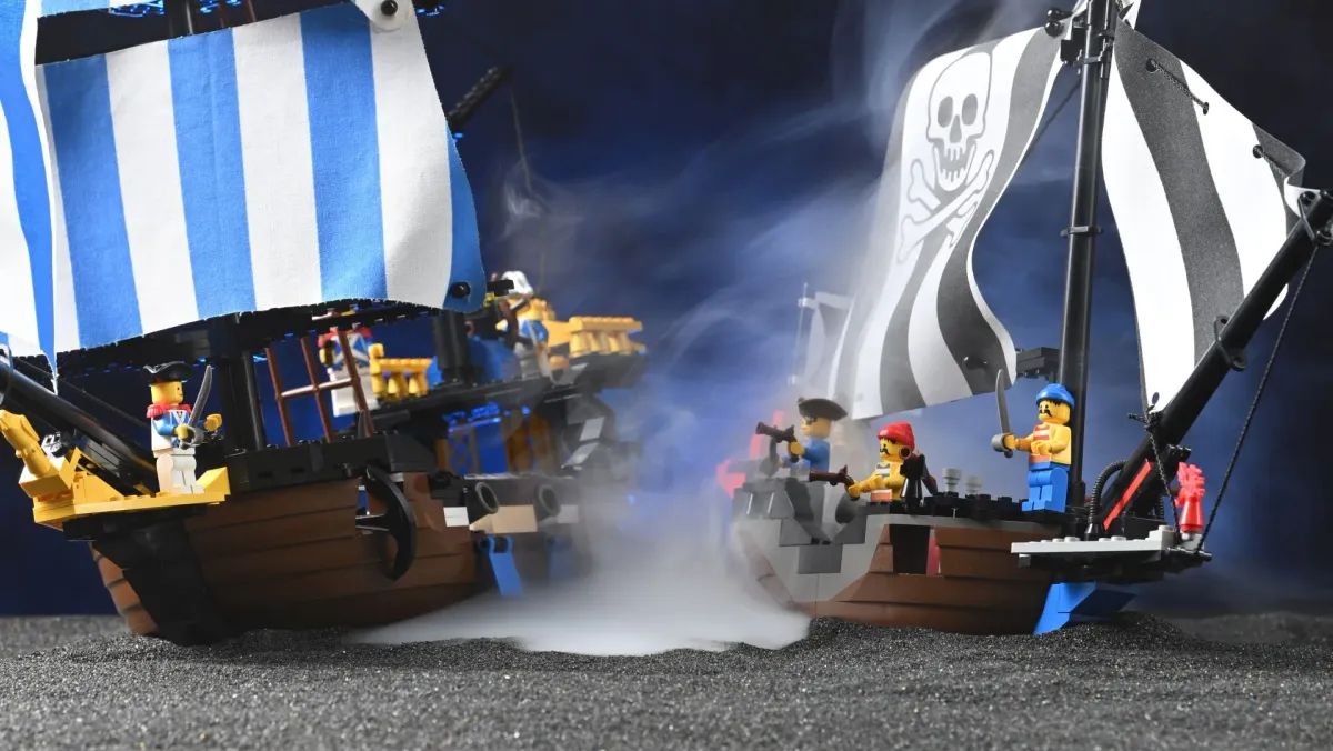 LEGO Pirates Renegade Runner (6268) and Caribbean Clipper (6274) photographed together in fog, evoking a naval standoff