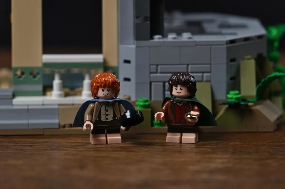 Close-up of the LEGO Frodo and Sam minifigures standing in front of the first completed section of Rivendell