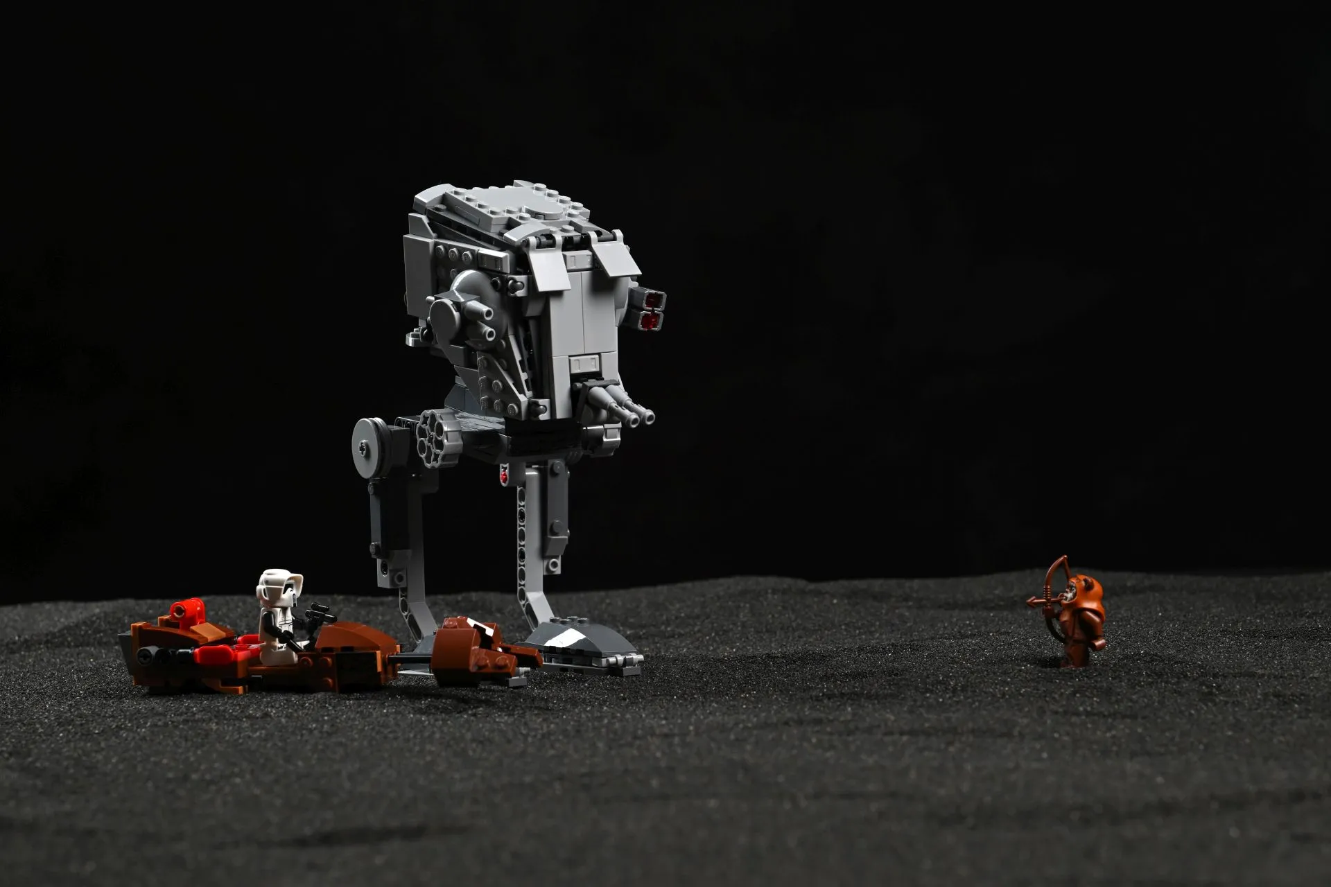 The LEGO Star Wars AT-ST Attack on Endor (75424) with a Scout Trooper riding the hijacked speeder bike, facing off against Wicket the Ewok with his bow