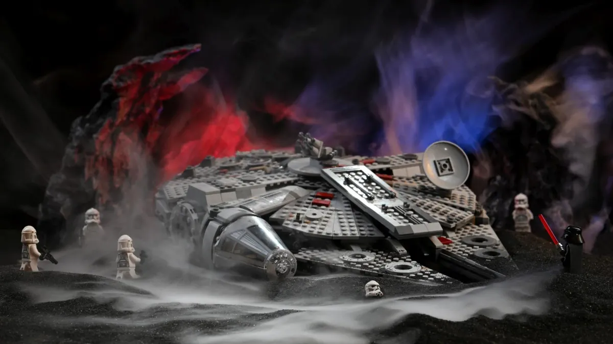 Minifigures patrolling around the LEGO Millennium Falcon in the mist, featuring clone troopers and detailed diorama terrain