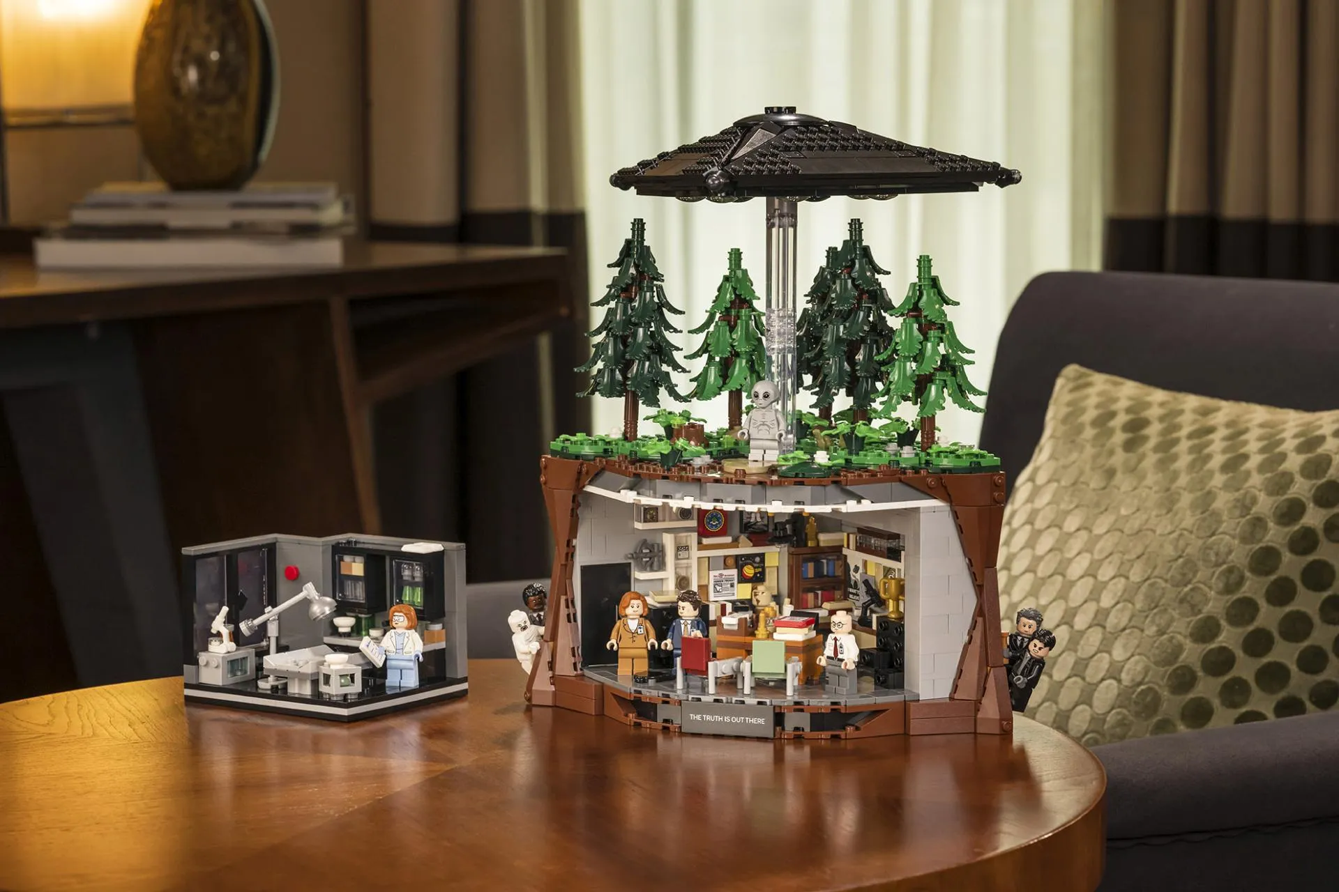 The LEGO Ideas The X-Files set 21369 on a table with the smaller Scully's Lab 40896 gift-with-purchase set built next to it