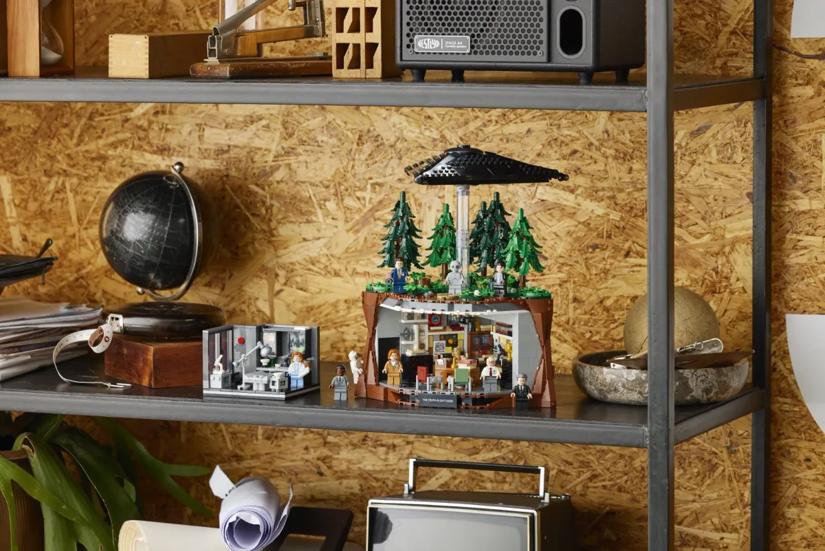 The LEGO Ideas The X-Files set 21369 displayed on a shelf with the smaller Scully's Lab 40896 gift-with-purchase set standing beside it