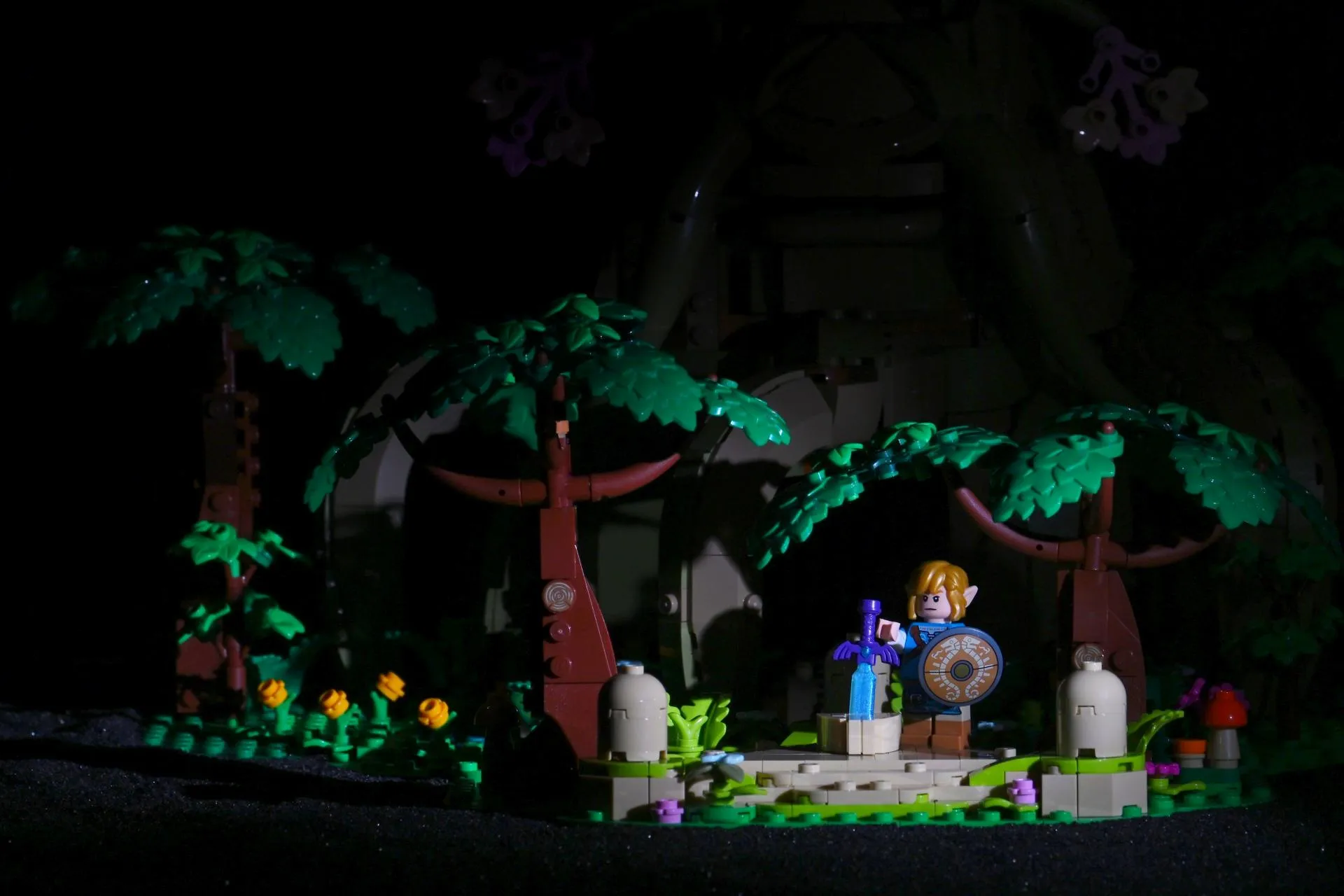Single SmallRig RM01 mini LED spotlight focused on Link and the Master Sword pedestal on the LEGO Great Deku Tree diorama