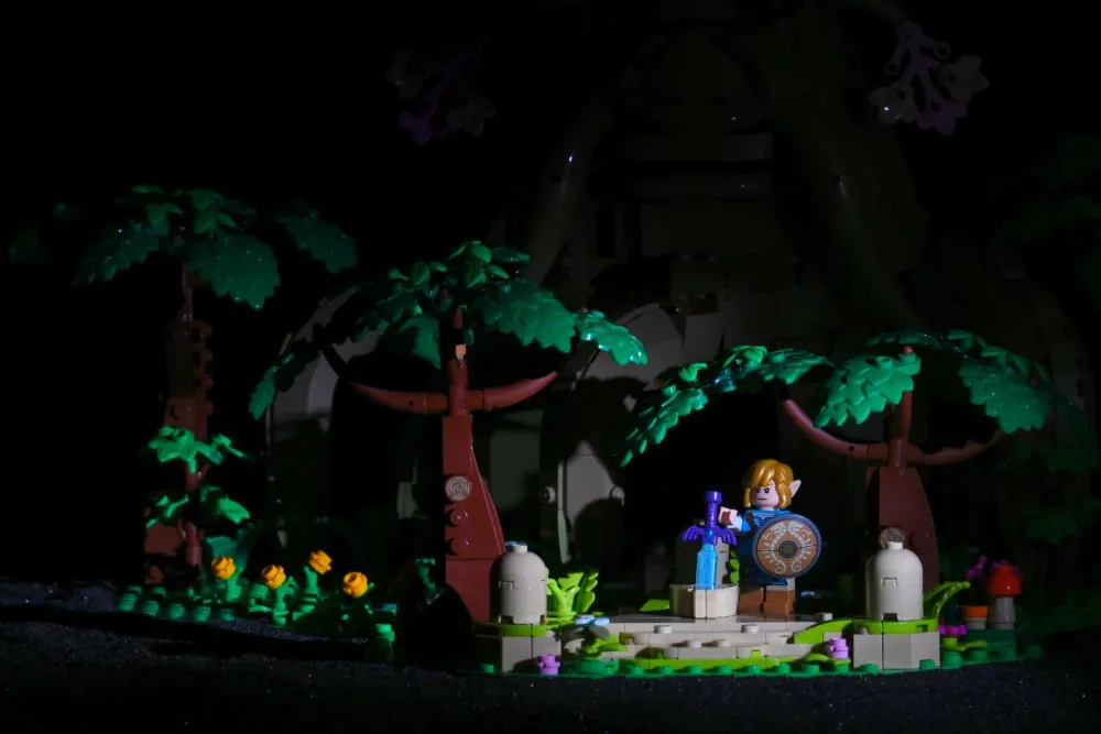 Single SmallRig RM01 mini LED spotlight focused on Link and the Master Sword pedestal on the LEGO Great Deku Tree diorama