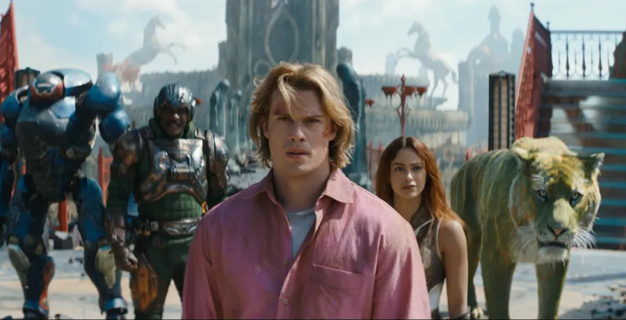 Nicholas Galitzine as Adam walking through Eternos with Roboto, Man-At-Arms, Teela and Cringer behind him