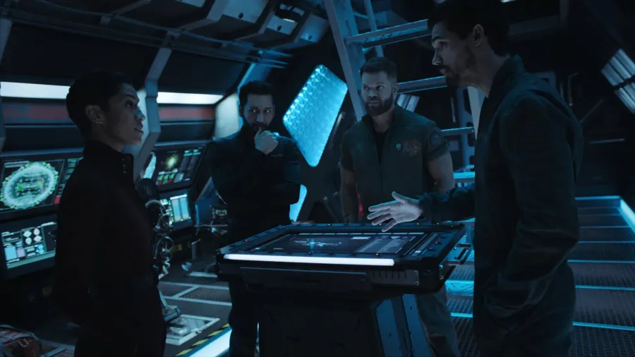 Bobbie Draper, Alex Kamal, Amos Burton and James Holden gathered around a tactical display aboard the Rocinante